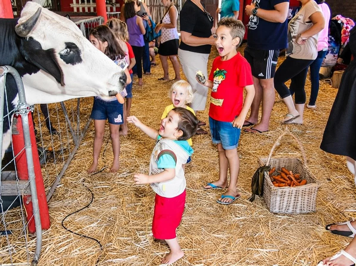 Children delighted by a cow at Lat Wai